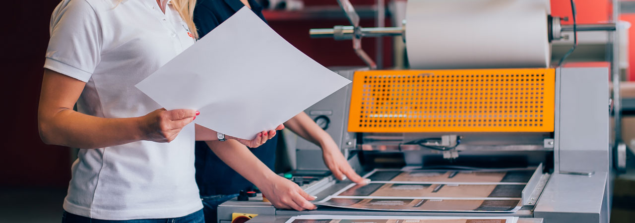 Women inspecting prints